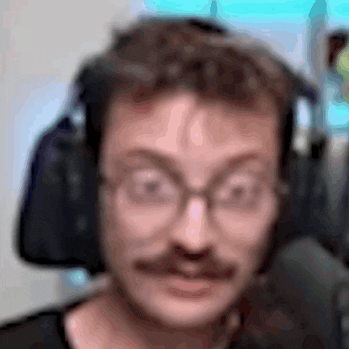 a blurry picture of a man wearing headphones