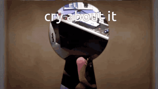 a keyhole with a picture of a man behind it and the words cry about it