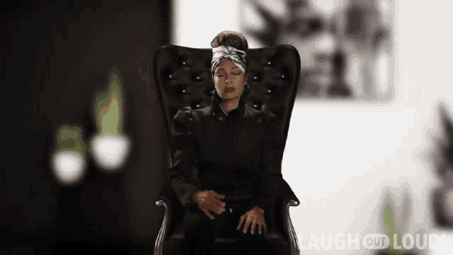 a woman is sitting in a chair with her eyes closed and laugh out loud written on the bottom