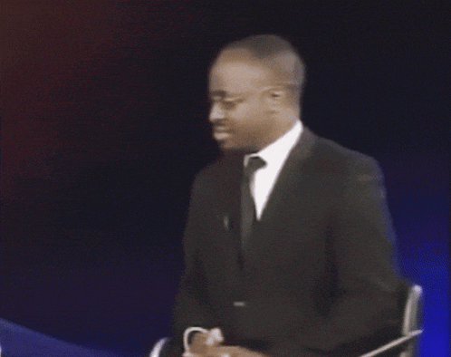 a man in a suit and tie asks why are you gae