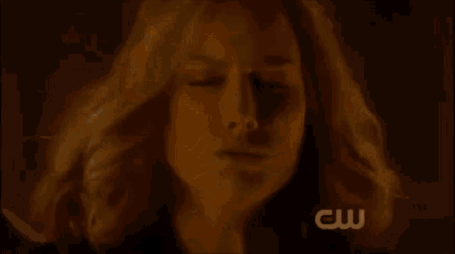a pentagram is surrounded by a circle of flames and a cw logo in the corner