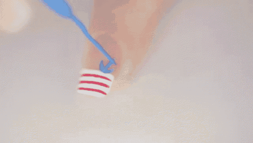 a close up of a person applying nail polish on their nails .