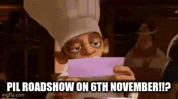 a cartoon character is holding a piece of paper and looking at it .