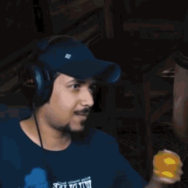 a man wearing headphones and a shirt that says milwaukee