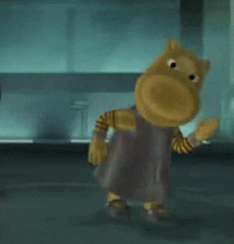 a cartoon character is standing in a dark room with a red object behind him