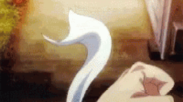 a white swan is dancing in a room with a fox in the background .