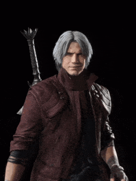 a man with gray hair and a beard is wearing a leather jacket