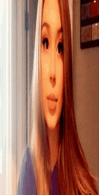 a close up of a woman 's face with a blurred background