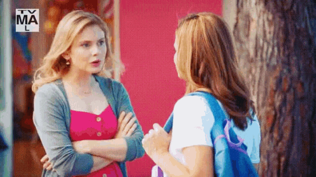 two women are standing next to each other with a tv ma logo in the background
