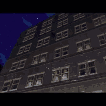 two people standing on top of a building with a crescent moon behind them