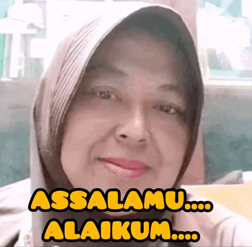 a woman wearing a hijab has the words assalamu alaikum written on her face