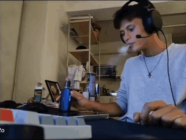 a man wearing headphones is smoking a cigarette
