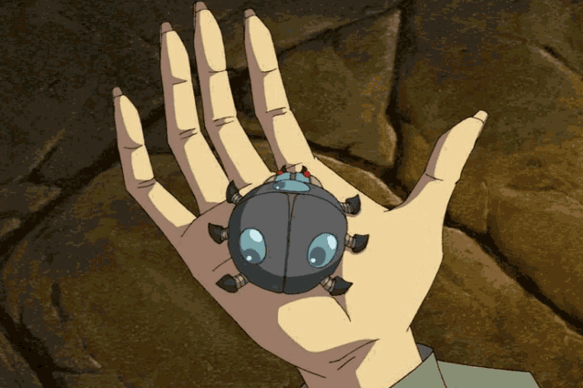 a person is holding a small bug in their palm