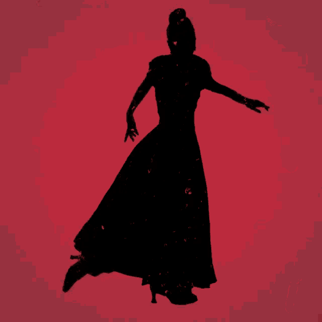 a silhouette of a woman in a long black dress and high heels