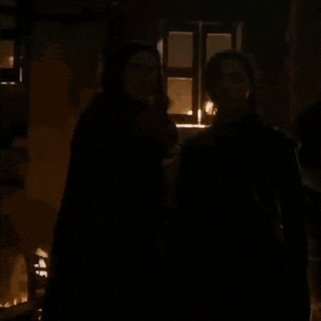 a couple of people standing in a dark room with the words what do we say to the god of death