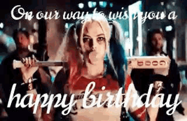 harley quinn from suicide squad is blowing a bubble gum while holding a gun and a pizza .