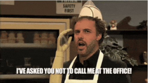 a man wearing an apron and gloves says " i 've asked you not to call meat at the office "