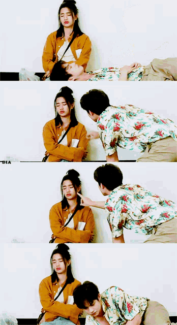 a man in a floral shirt is pointing at a woman 's face