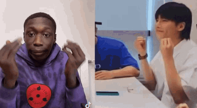 a man wearing a purple hoodie with a red eye on it next to a man wearing a white shirt
