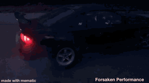 a black car is parked in the dark with the words forsaken performance written below it