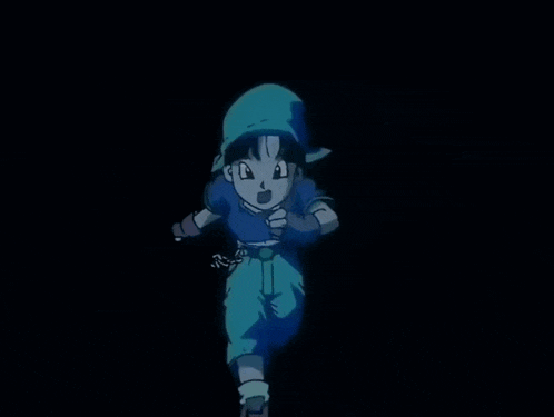 a little girl in a blue shirt and blue shorts is running in the dark
