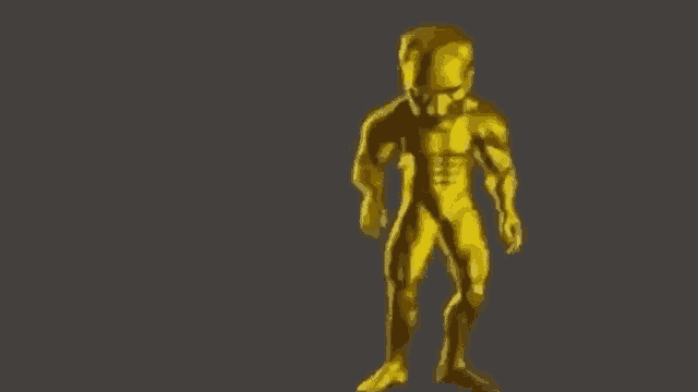 a golden statue of a man with a helmet on his head is standing on a gray background .