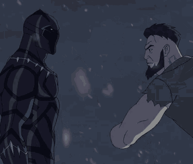 a man with a beard is standing next to a black panther .