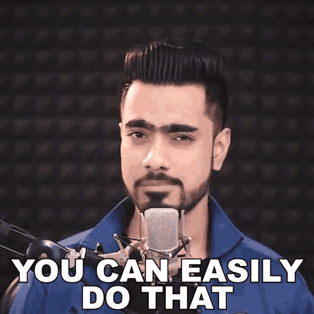 a man singing into a microphone with the words you can easily do that behind him