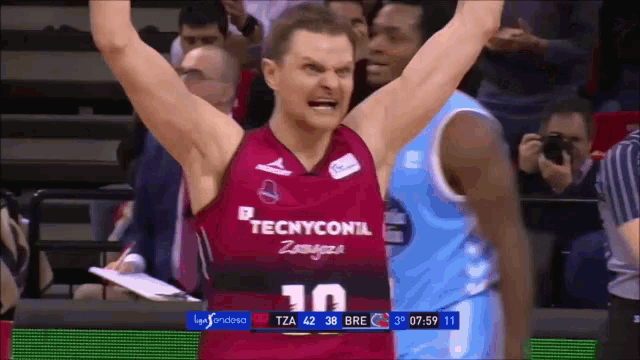 a basketball player wearing a jersey that says tecnyconil on it