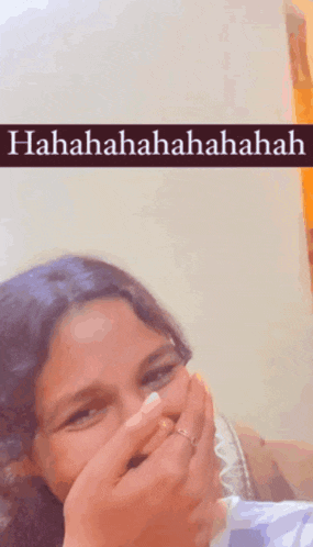 a woman covering her mouth with her hands with a caption that says ' hahahaha '