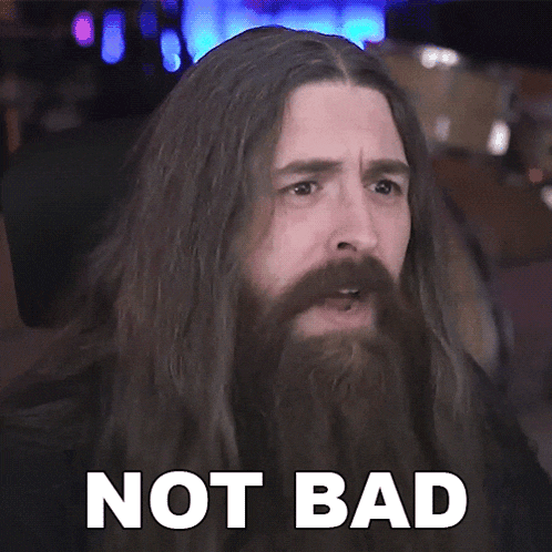 a man with long hair and a beard has the words not bad written on his face