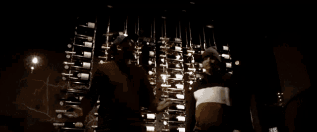a man sits on a set of stairs with another man