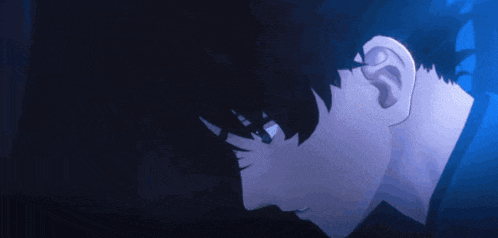 a close up of a person 's face in the dark with a blue background