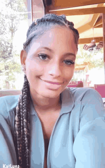a woman with braids and katluna written on the bottom
