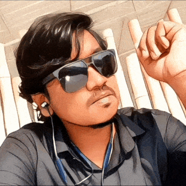 a man wearing sunglasses and earbuds looks at the camera