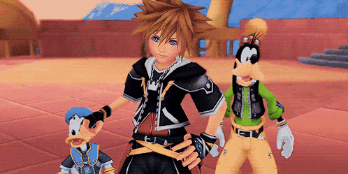 a video game character named sora stands next to goofy and donald duck