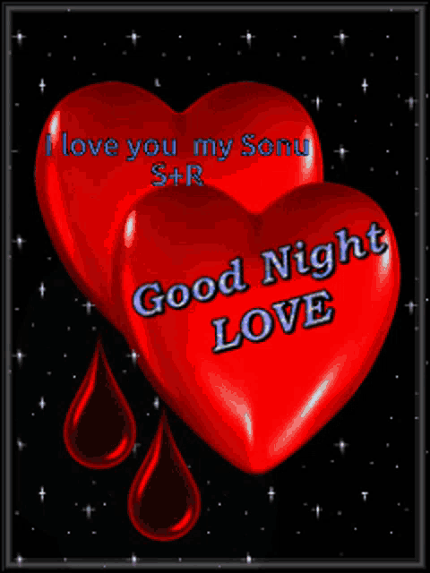 a couple of red hearts that say good night love on them