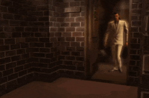a man in a white suit is dancing in front of a door