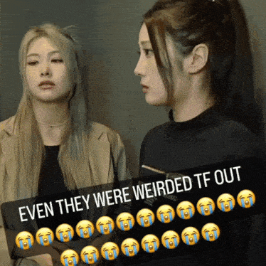 two women are standing next to each other with a sign that says even they were weirded tf out