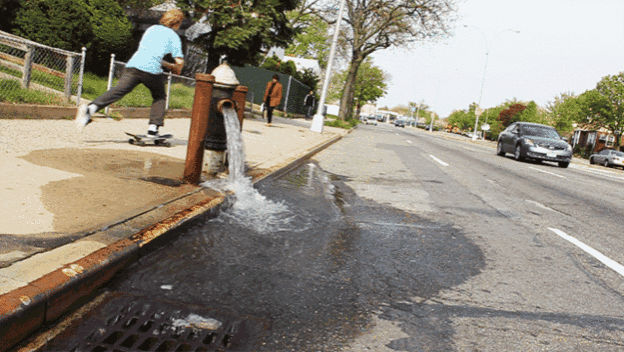 a man is skateboarding near a fire hydrant