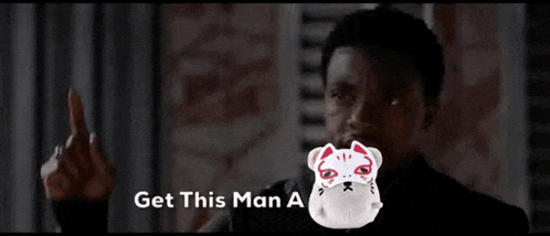 a man with a cat mask on his face and the words get this man a