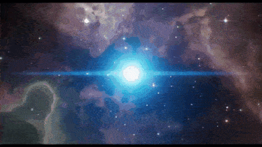 a blue star in the middle of a galaxy with a lot of stars