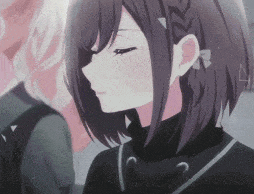 a close up of a girl 's face with a bow on her hair