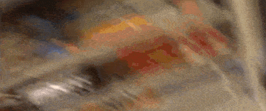 a close up of a person 's feet walking on a sidewalk in a blurry photo .
