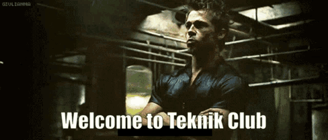 a man in a dark room with the words welcome to teknik club