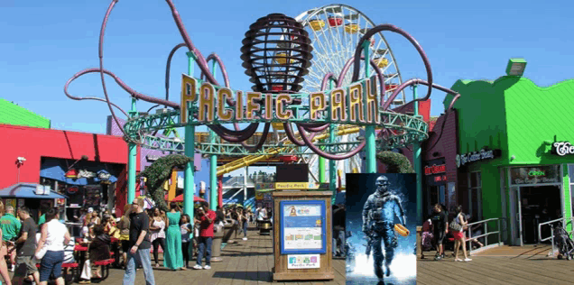pacific park has a ferris wheel and many people