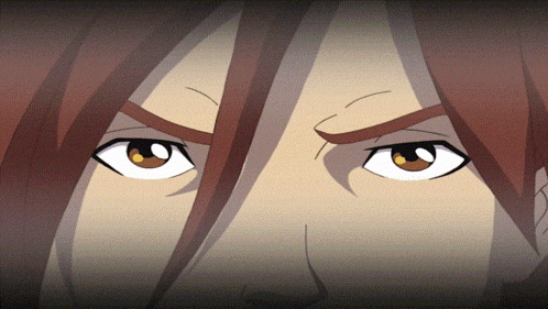 a close up of a cartoon character 's eyes with a dark background
