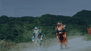 two kamen riders standing on a dirt road
