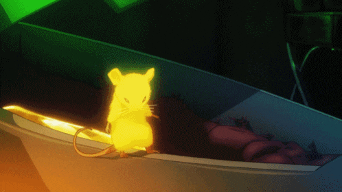 a glowing yellow mouse is sitting in a coffin