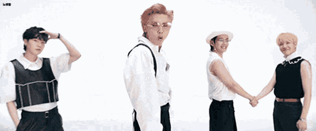a group of people are standing next to each other holding hands and dancing .